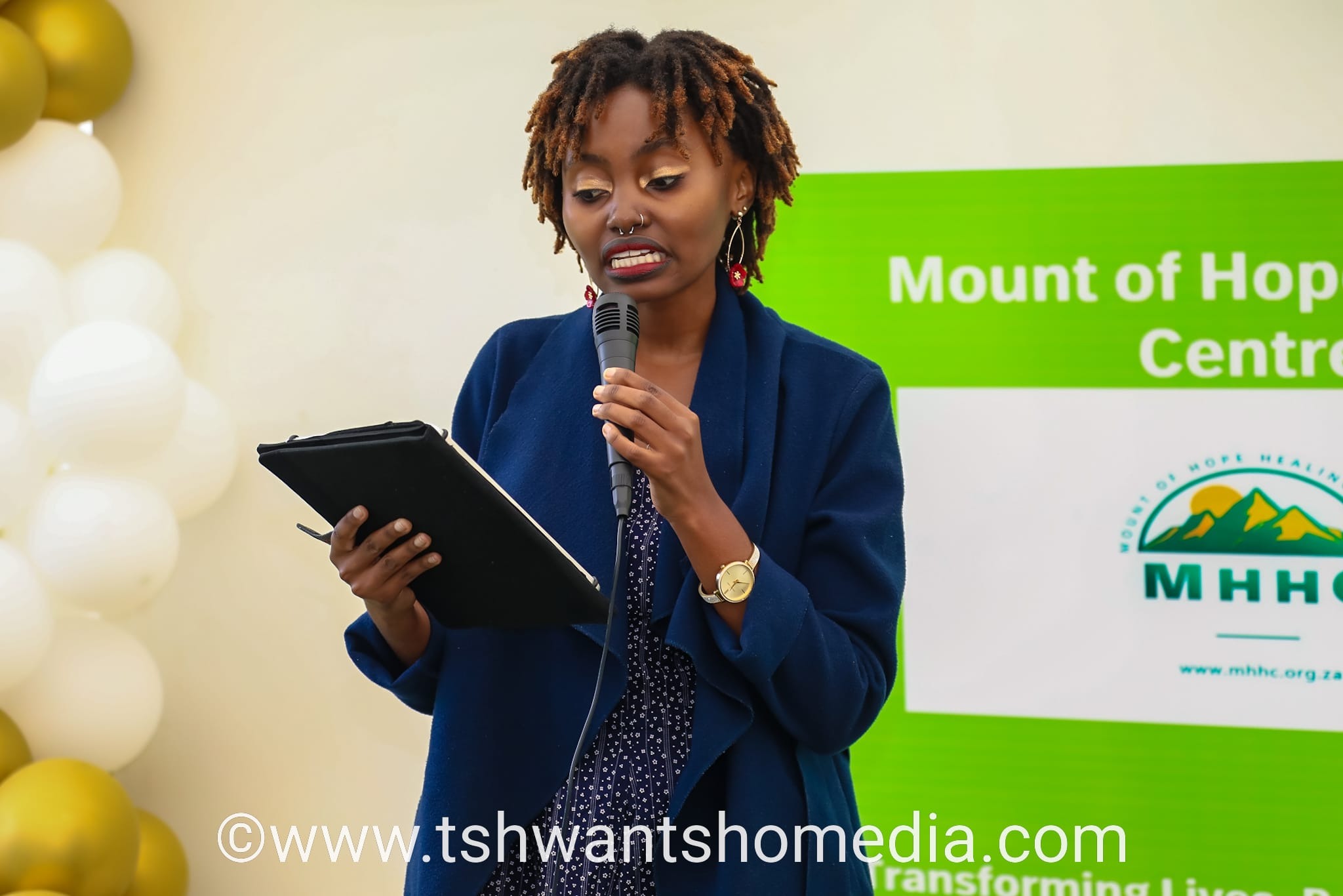Woman speaking with tablet
