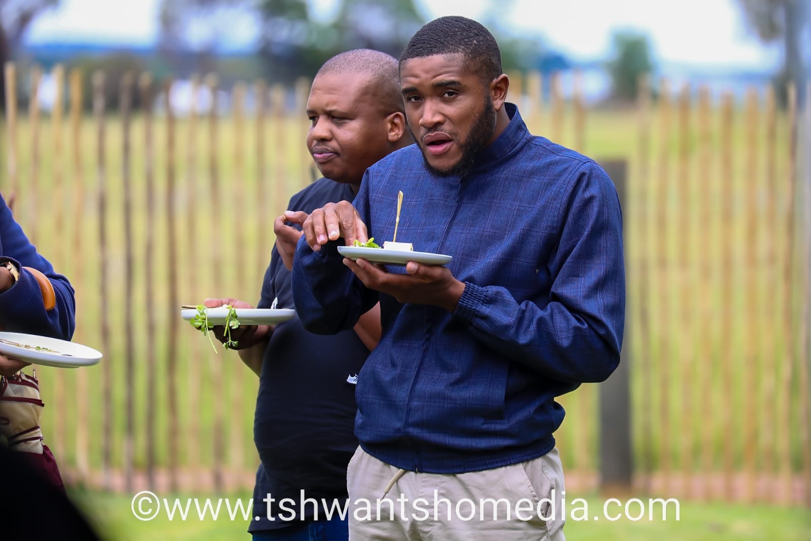 Men sharing food