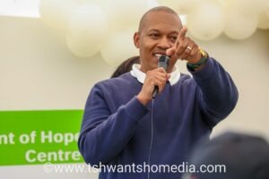 Man pointing while speaking